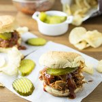 Leftover bbq pork shines when you pair it with a quick peach bbq sauce and pile it on a soft, fresh bun for this simple sandwich! | Recipe from Chattavore.com