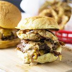 This honey BBQ bacon cheeseburger is perfectly pan-fried in cast iron and topped with bacon and creamy bbq sauce. It's hard to beat! | Recipe from Chattavore.com