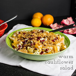 This warm cauliflower salad is healthy, with clementine sections and pomegranate seeds, but also lush with vinaigrette, pine nuts, and buttered bread crumbs. | Recipe from Chattavore.com